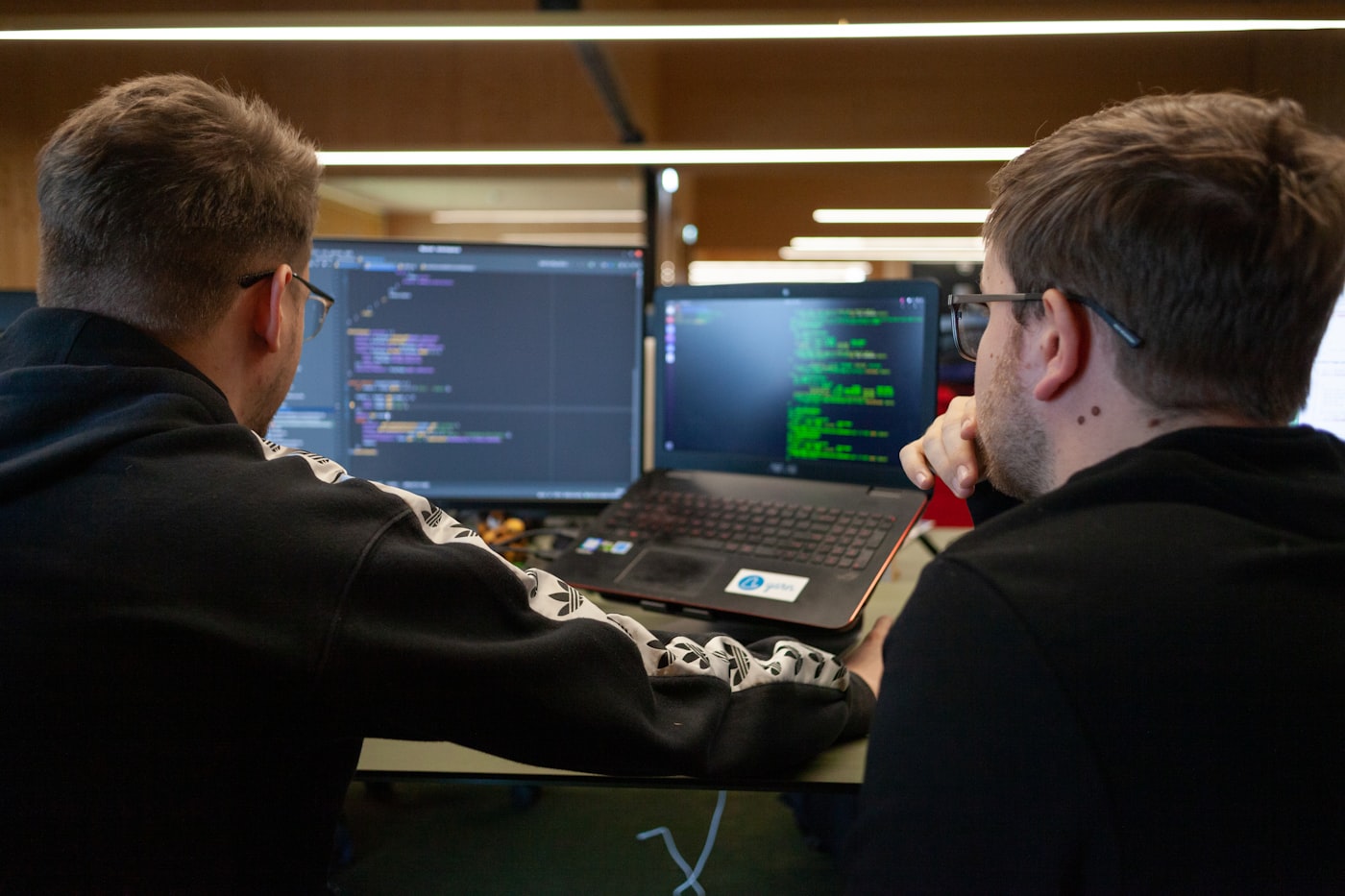 Two engineers pairing at a screen