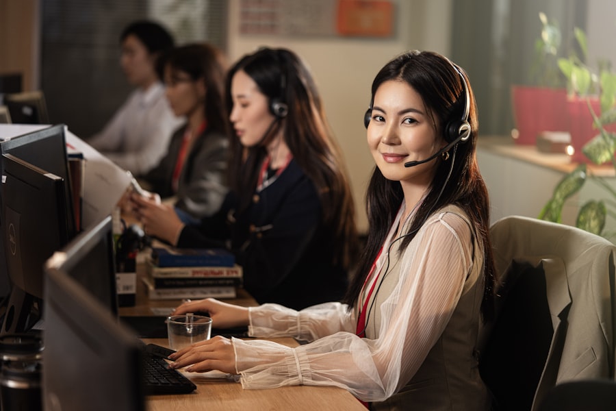 A support agent wearing a headset at a desk