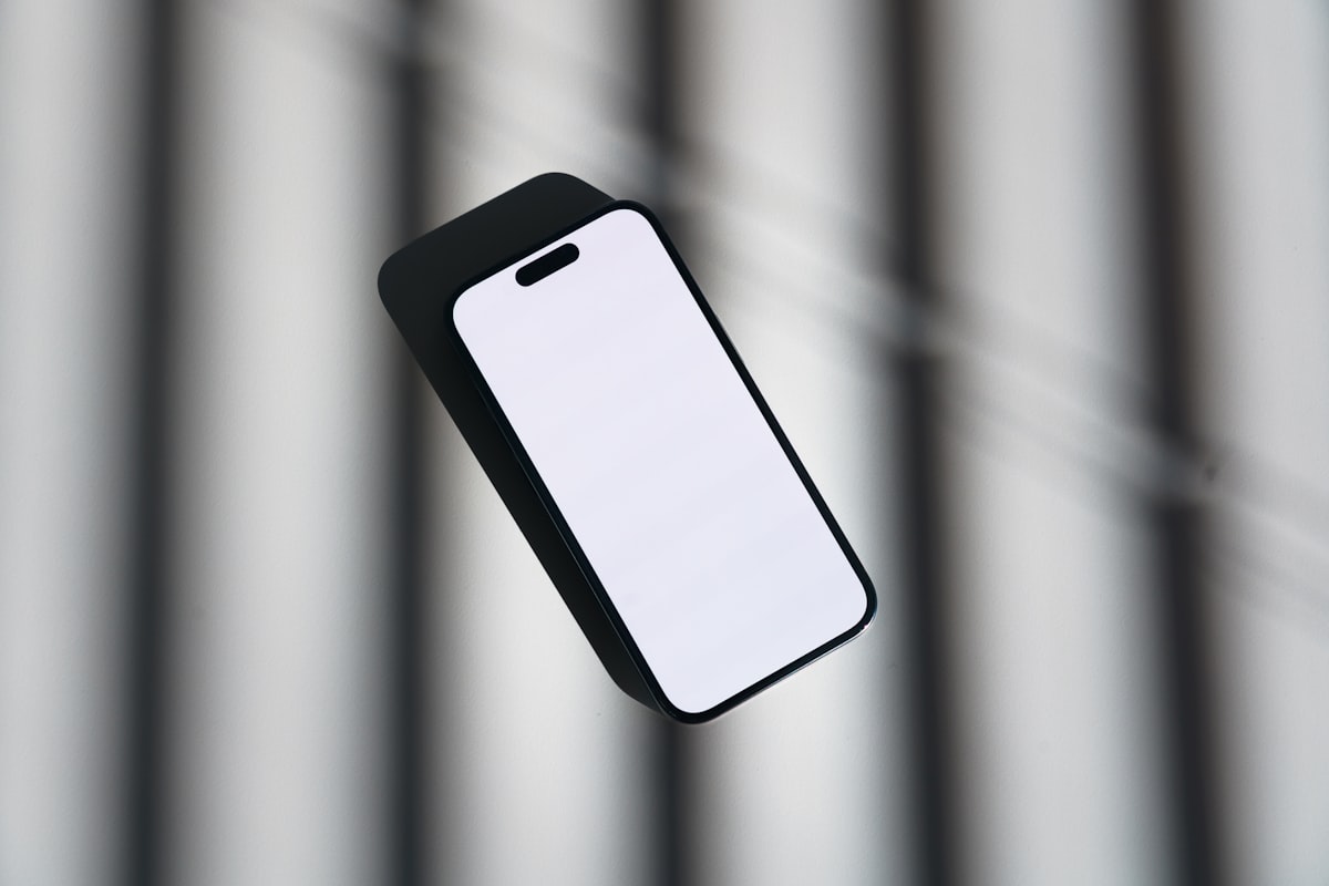 A smartphone held up against a blurred background